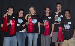 Photo of second place team holding their ribbons.