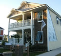 Photo of manufactured house with side panel cut out.